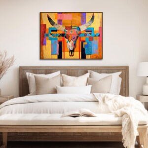 a bed room with a neatly made bed and a painting on the wall