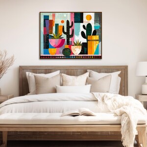 a bed with a white comforter and a painting on the wall