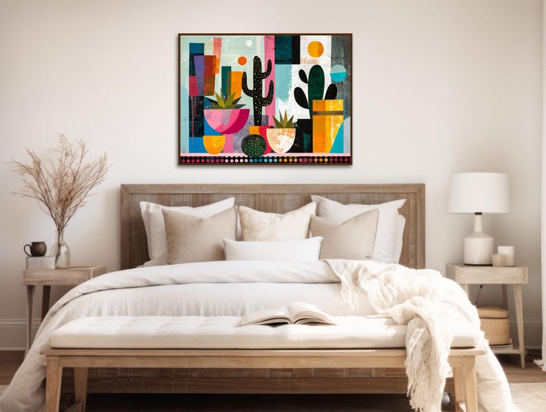 a bed with a white comforter and a painting on the wall