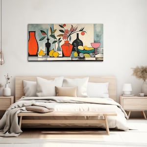 a bedroom with a bed and a painting on the wall