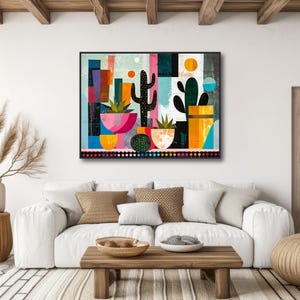 a living room with a white couch and a painting on the wall