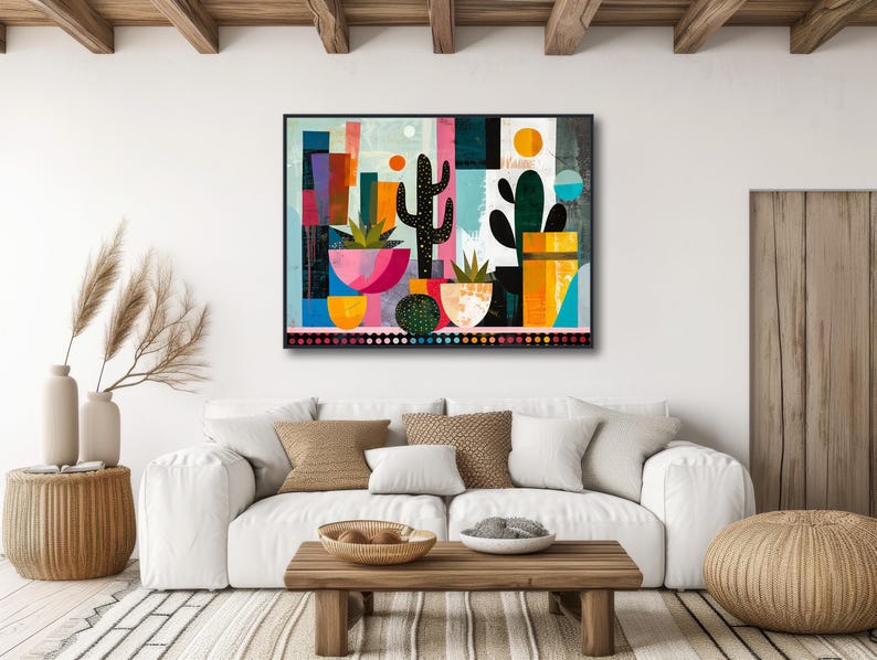 a living room with a white couch and a painting on the wall