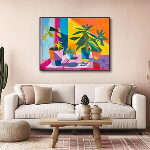 a living room with a white couch and a painting on the wall
