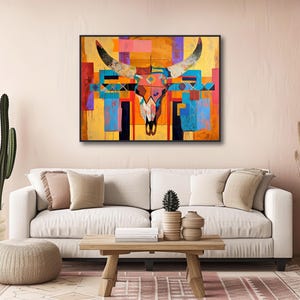 a living room with a couch and a painting on the wall