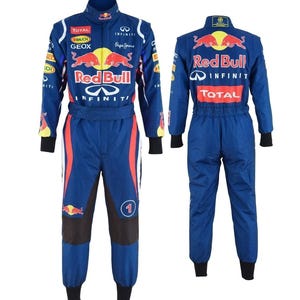 May include: A blue Red Bull racing jumpsuit with multiple sponsor logos, including "INFINITI" and "TOTAL." The suit features red and white accents, a black collar, cuffs, and a number "1" on the leg. The back displays the Red Bull logo.