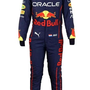 May include: Navy blue racing suit with red and yellow accents. The suit features sponsor logos including "Oracle" and "Red Bull." The suit has long sleeves and legs, with the name "MAX" printed on the chest.