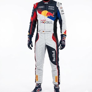May include: A racing suit in white, navy, and red, featuring Red Bull branding. The suit includes gloves and boots, with sponsor logos like Oris, Bosch, and Sparco. The suit has a black collar and accents, with the Red Bull logo prominently displayed.