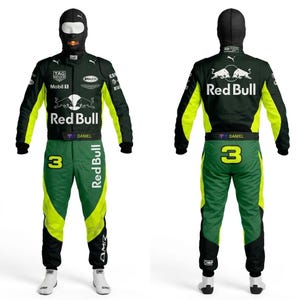 May include: A racing suit in green, black, and yellow, featuring the Red Bull logo and the number 3. The suit has multiple sponsor logos and the name "DANIEL". Includes a matching balaclava and white racing boots.