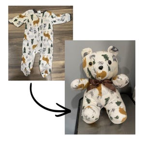 May include: A white baby sleepsuit with a forest and deer pattern is shown next to a handmade teddy bear. The bear is made from the same fabric as the sleepsuit and has a brown ribbon tied around its neck.