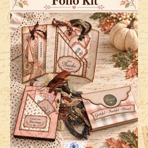 May include: A Mini Thankful Folio Kit featuring paper folios with pockets, tags, and ribbons. The items display text including "Mini Thankful Folio Kit," "THANKFUL," "Give Thanks," "Count your Blessings," "Blessed," and "Grateful • Thankful • Blessed."