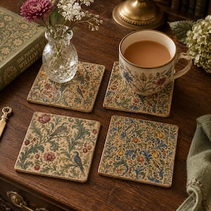 May include: A set of four square coasters featuring a detailed botanical and avian pattern in muted tones of green, blue, red, and gold. Each coaster displays intricate illustrations of birds, flowers, and foliage on a textured, light-colored background.