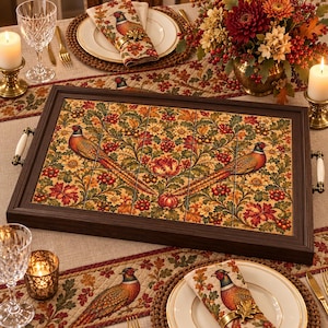 May include: A rectangular wooden serving tray featuring a tiled surface with a decorative autumn-themed pattern. The design displays two pheasants surrounded by colorful fall foliage, berries, and flowers. The tray has two white ceramic handles.