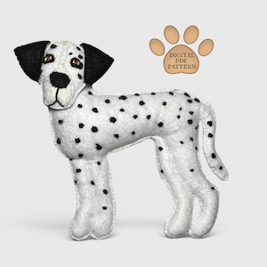 May include: A stuffed Dalmatian dog with black spots on a white body. The dog has black ears and brown eyes. The image includes a paw print graphic with the text "DIGITAL PDF PATTERN".