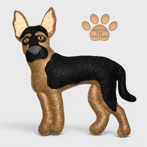 May include: A stuffed German Shepherd dog with tan and black felt. The dog has a black nose and a black patch on its back. The image includes a paw print graphic with the text "DIGITAL PDF PATTERN".
