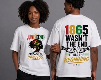 May include: White t-shirts with graphic designs. One shirt features "Juneteenth" with a woman's silhouette and the text "Freedom is Timeless." The other shirt displays "1865 Wasn't the End" with broken chains and "It Was the Beginning."