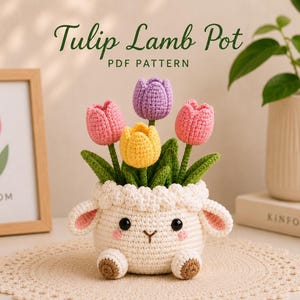 May include: A crochet pattern titled Tulip Lamb Pot PDF Pattern featuring a white lamb-shaped pot with pink cheeks and brown feet, holding four crocheted tulips in purple, pink, and yellow with green stems and leaves, displayed on a round mat.