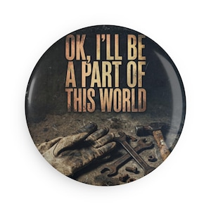 May include: Round button with the text "OK, I'll be a part of this world" in a distressed font. The button features a background of tools, including a hammer, wrenches, and work gloves, suggesting a mechanic or construction theme.
