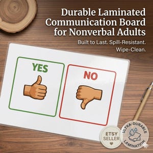 Puede incluir: Tablero de comunicación laminado duradero para adultos no verbales. Presenta secciones de "SÍ" y "NO" con ilustraciones de pulgares arriba y abajo. También se ve el texto "Built to Last. Spill-Resistant. Wipe-Clean."