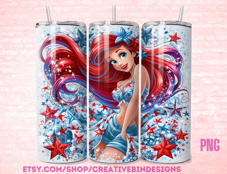 May include: A white tumbler featuring a patriotic design with a cartoon mermaid. The design includes red and blue stars, and the mermaid is wearing a star-spangled top and shorts. The tumbler has a silver lid and a straw.