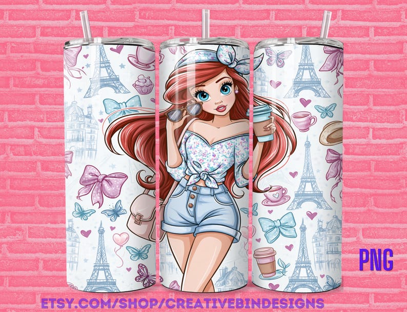 May include: A cylindrical tumbler with a straw featuring a cartoon illustration of a person with long red hair, a floral top, and denim shorts. The background pattern includes blue Eiffel Towers, pink bows, butterflies, coffee cups, and hearts.