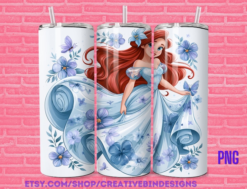 May include: White tumbler featuring a princess in a light blue gown with red hair, surrounded by blue flowers and butterflies. The tumbler has a silver lid and straw. The text "PNG" and "ETSY.COM/SHOP/CREATIVEBINDESIGNS" are visible.