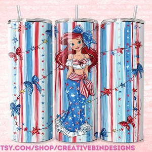 May include: A cylindrical tumbler with a straw featuring a red, white, and blue vertical striped pattern decorated with small stars and bows. The center displays a cartoon character with long red hair wearing a patriotic outfit with a large blue bow.