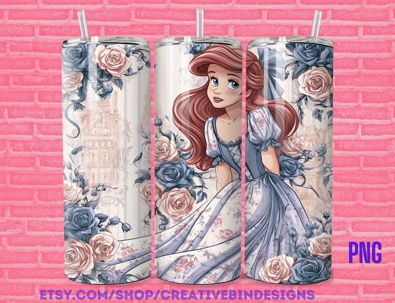 May include: A stainless steel tumbler featuring a princess illustration in a blue and white dress, surrounded by blue and pink roses. The tumbler has a straw and is decorated with a floral and architectural design. The text "PNG" is visible.
