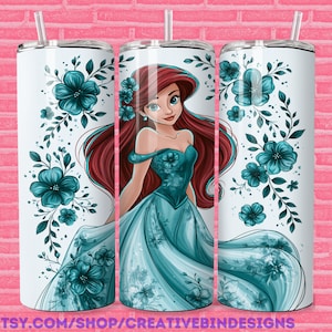 May include: White tumbler with a teal floral design and a portrait of a red-haired woman in a teal gown. The tumbler has a silver lid and a clear straw. The text "PNG" is visible on the right side.