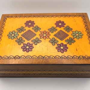 Hand-carved and hand-painted Polish folk-art wooden box with floral motifs and scrollwork. Vintage 1960s-1980s Krakow workshop piece