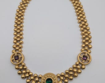 Collar llamativo vintage de Givenchy, de pasarela, firmado, en tono dorado, con cristal verde púrpura.