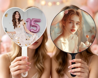 May include: Two handheld mirrors with custom photo prints. One mirror is heart-shaped with a clear handle, displaying a person in a white dress with a pink number 15 balloon. The other is circular with a black handle, showing a portrait.