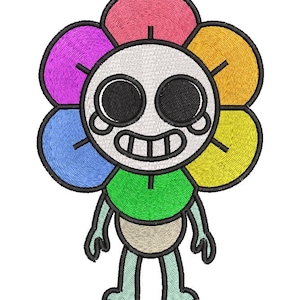 Op de afbeelding: Een geborduurde patch met een stripfiguur met een bloemvormig hoofd. De bloemblaadjes zijn roze, geel, oranje, groen, blauw en paars. Het figuur heeft een wit gezicht, grote zwarte ronde ogen, een brede grijns en lichtblauwe ledematen.