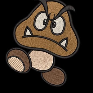 Puede incluir: Un parche bordado que muestra un personaje Goomba marrón con cara color canela, ojos blancos y dos dientes blancos afilados. El personaje tiene un contorno negro grueso, una expresión de enfado y dos pequeños pies marrones.