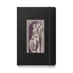 May include: Black journal with an elastic closure and a rectangular image of a classical nude figure holding a spear and shield. The image is in a sepia tone and has the text "Pallas Athena" at the top.