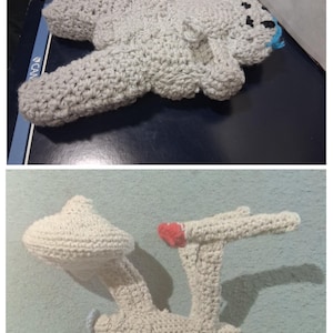 May include: Handmade crochet toys. The top image shows a gray crocheted seal with black and blue accents. The bottom image shows a white crocheted Star Trek Enterprise ship with a red accent.