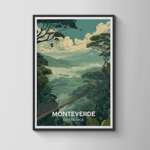 May include: A framed travel poster depicting the Monteverde, Costa Rica cloud forest. The scene features a long suspension bridge stretching across a lush, green valley with dense trees, misty mountains in the distance, and white clouds.