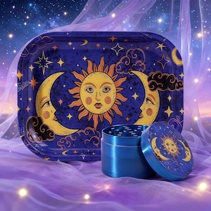 May include: A celestial-themed rolling tray set featuring a rectangular tray, a grinder, and a grinder lid. The set has a dark blue background with a sun, moon, and star design. The grinder and lid are blue.