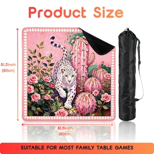 May include: A square game mat measuring 31.5 inches by 31.5 inches, featuring a pink-toned illustration of a leopard among roses and cacti, with a black carrying bag. The text Product Size and SUITABLE FOR MOST FAMILY TABLE GAMES is visible.