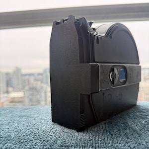 May include: A set of three ceramic mugs with a speckled, matte finish. The mugs are in shades of cream, light gray, and dark gray. Each mug has a simple, minimalist design and a rounded handle.