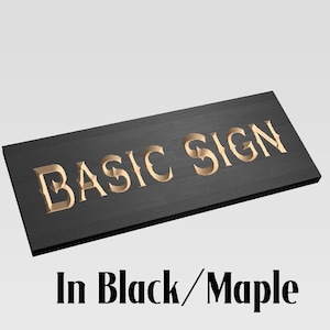 May include: A black and maple wood sign with the text "BASIC SIGN" in gold lettering.
