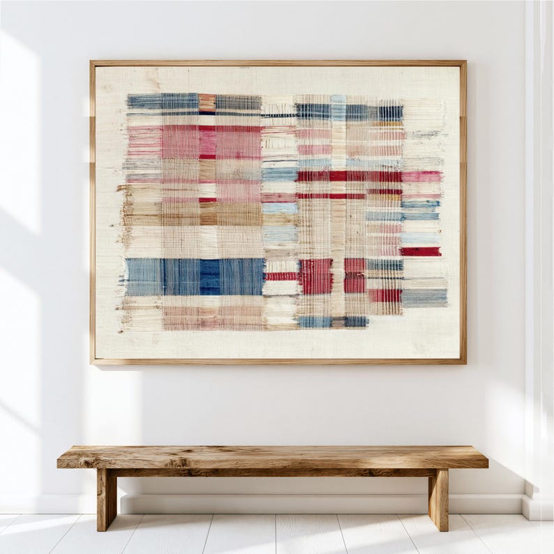 May include: A rectangular wall art piece featuring a woven textile design with a grid of horizontal and vertical threads in shades of cream, deep blue, muted red, and tan, all encased within a simple light-toned wooden frame.
