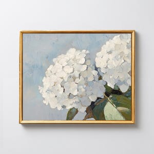 May include: A white ceramic mug with a black handle and the text "But First, Coffee" in a black, bold font. The mug is sitting on a wooden surface. The mug is approximately 4 inches tall.