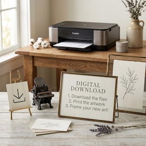 May include: A gold-toned metal frame displaying a white sign with the black text DIGITAL DOWNLOAD, 1. Download the files, 2. Print the artwork, 3. Frame your new art! Next to it is a small gold easel with a download icon and a second frame.