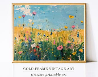 May include: A framed vintage art print with a gold frame. The artwork depicts a colorful field of wildflowers under a blue sky. The text at the bottom reads "GOLD FRAME VINTAGE ART" and "timeless printable art."