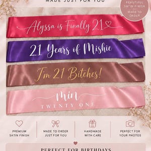 May include: Four satin sashes in hot pink, purple, bronze, and light pink. The hot pink sash reads "Alyssa is Finally 21", the purple reads "21 Years of Mishie", the bronze reads "I'm 21 Bitches!", and the light pink reads "min TWENTY ONE".