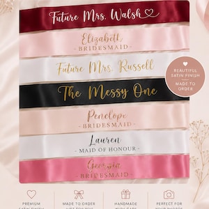 May include: A collection of seven satin sashes in various colours including burgundy, light pink, white, black, and hot pink. Each sash features custom text in gold, white, or black script and block lettering, displaying names and titles.