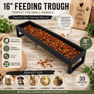 May include: A black 16-inch rectangular feeding trough for small animals, featuring a raised design made from durable PLA material. The trough is filled with multi-colored dry pet food, and the text 16" FEEDING TROUGH is visible above it.