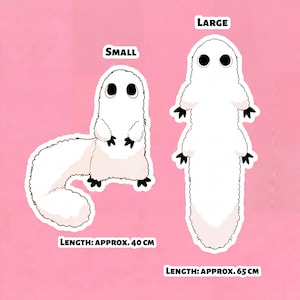 May include: Two white creature stickers, labelled "Small" and "Large", with black eyes and feet, on a pink background. The small sticker is approx. 40 cm long, and the large sticker is approx. 65 cm long.