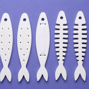 Conjunto de pendientes, collar y soporte para anillos con forma de espina de sardina impresos en 3D