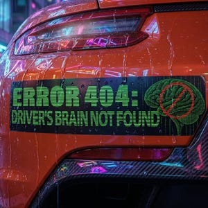 May include: A black bumper sticker with the text "ERROR 404: DRIVER'S BRAIN NOT FOUND" in green, alongside a green brain graphic with a red no-entry symbol. The sticker is affixed to the rear of an orange car.